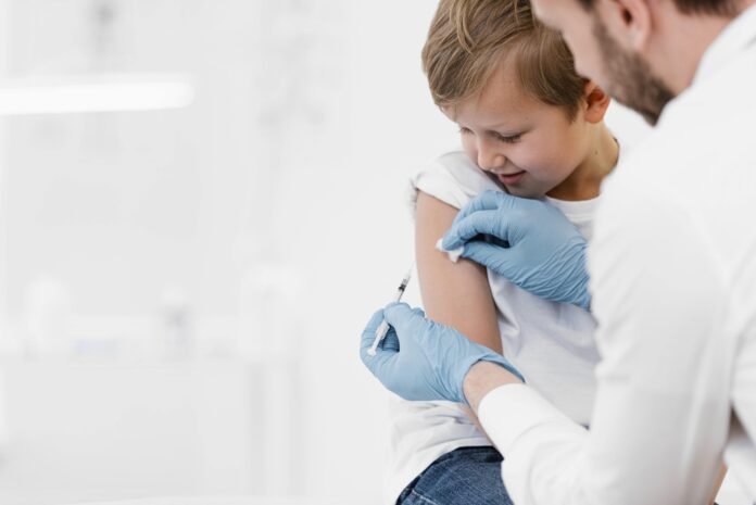 close-up-doctor-vaccinating-kid-min